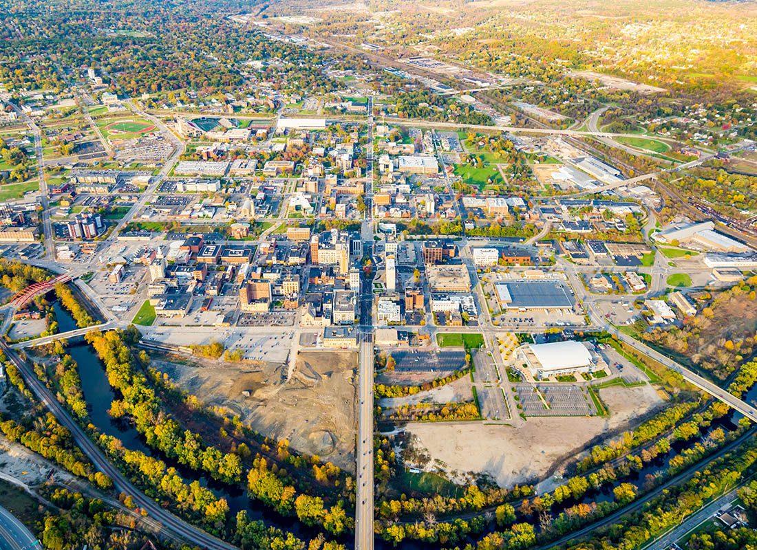 Contact - Aerial View of Youngstown, Ohio Displaying Many Buildings and Trees on a Sunny Day